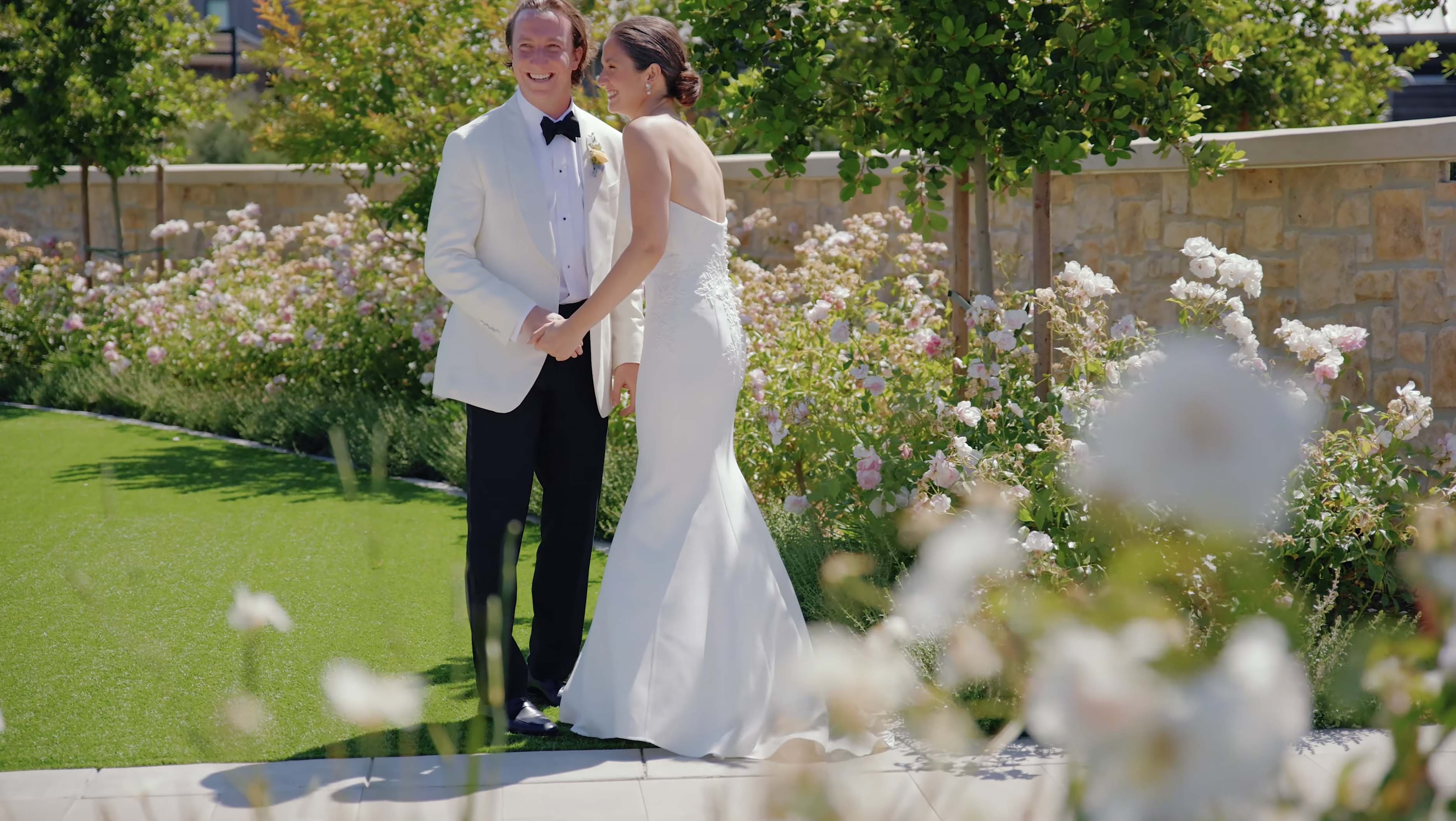 Bride and groom standing together in the gardens at Stanly Ranch