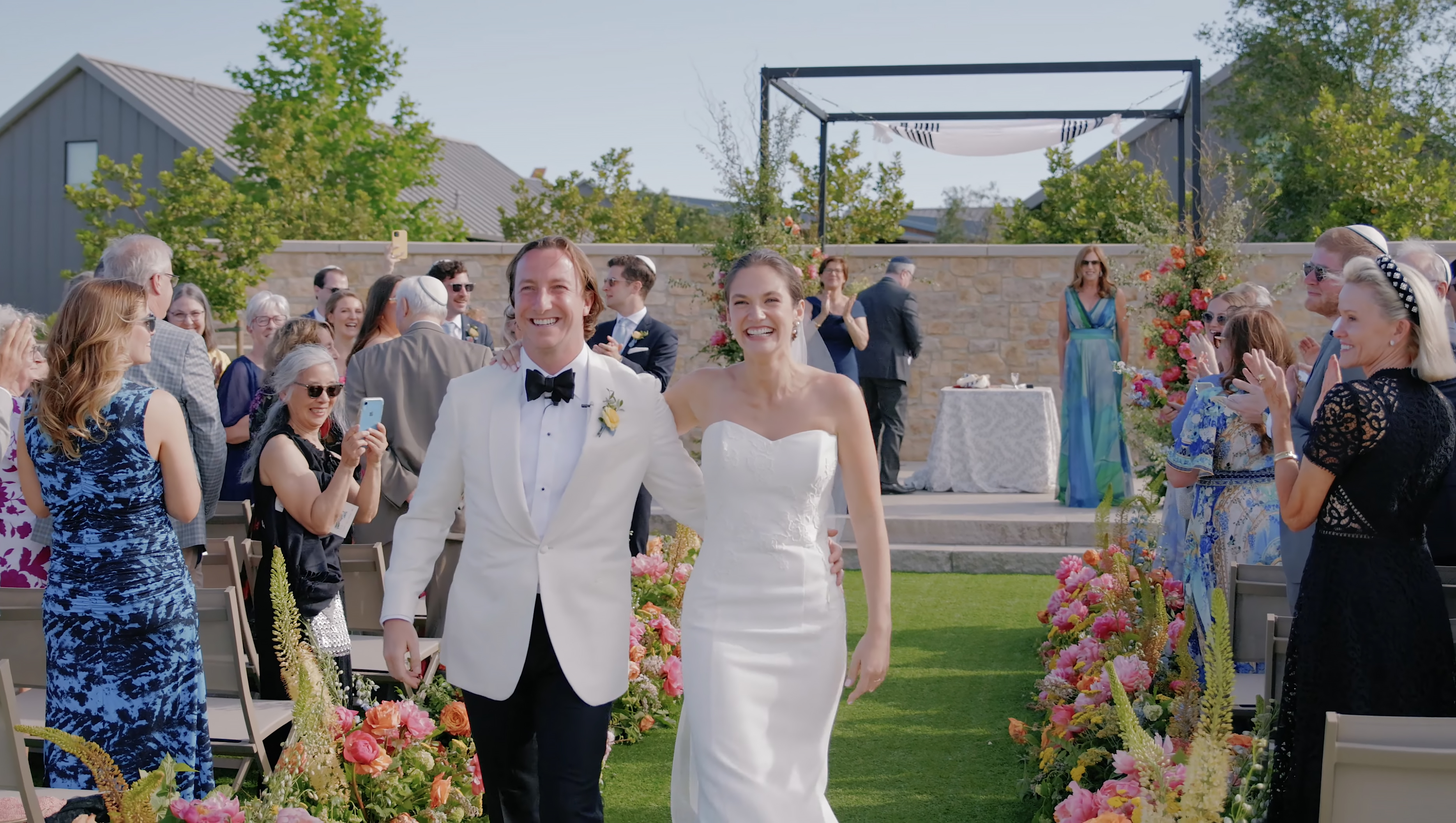 Bride and groom walking down the aisle after a Stanly Ranch ceremony