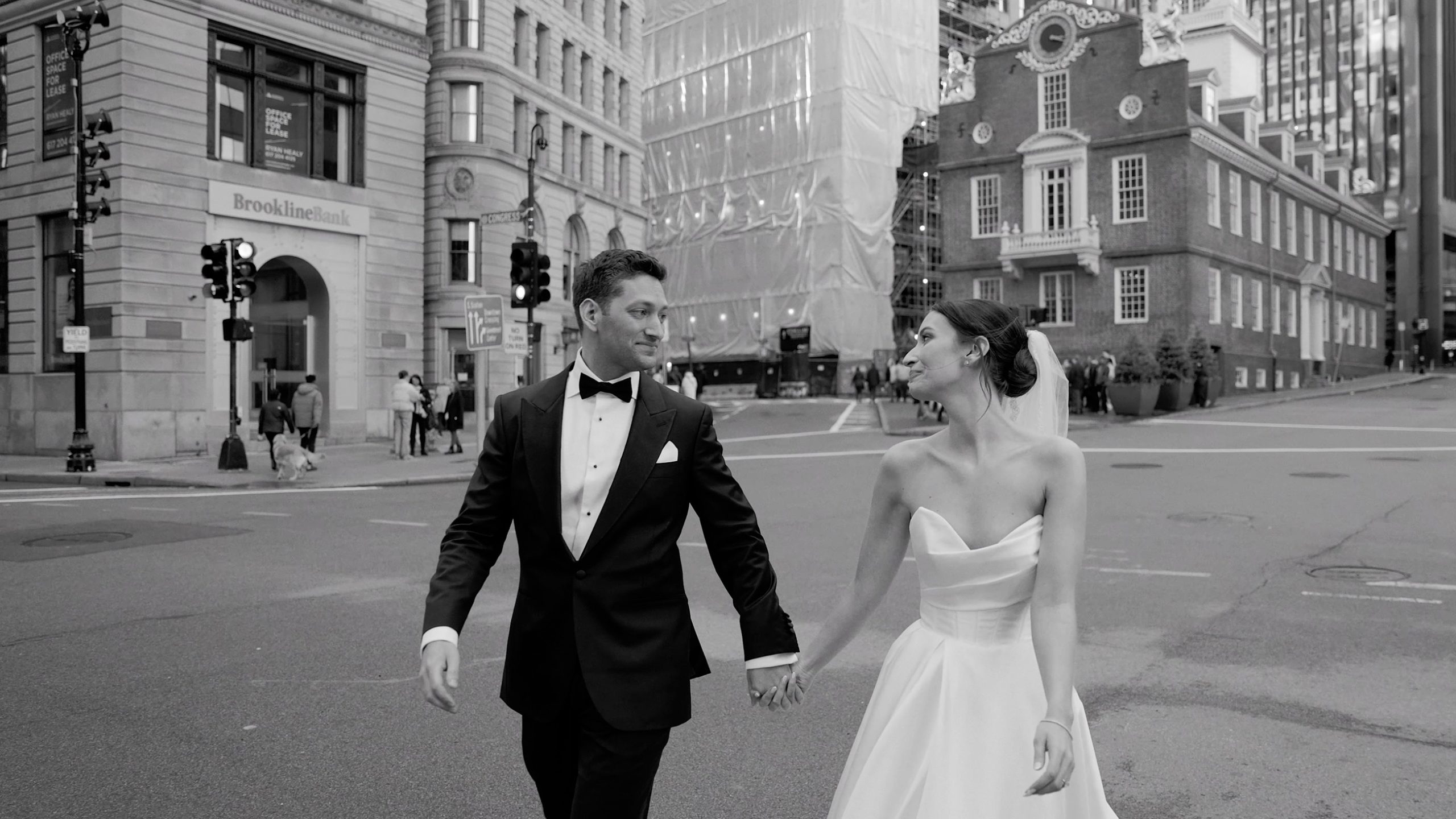 Jenny and Jose walking through Boston on their wedding day